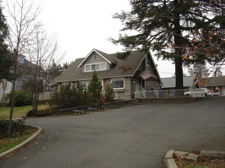 Beautiful property in the heart of Grants Pass.  Property consists of 3 separate building.  The main home is approx. 2400 sq ft.  There is a kitchen with 2 full baths and one half bath.  The 2nd building is approx. 1100 sq ft. with 4 rooms and a full bath.   The 3rd building is approx 460 sq. ft . Great location on .42 acre lot.