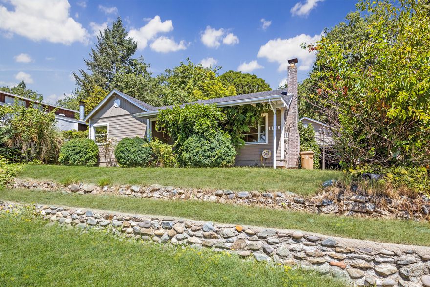 Charming and updated 3 bed, 1 bath home nestled in the desirable NW hills of Grants Pass! Enjoy new wood-look laminate flooring, and a bright, open kitchen. The existing fireplace would be perfect for a gas insert.  The spacious floor plan creates a warm, inviting atmosphere, perfect for everyday living or entertaining. Step outside to a tiered backyard with mature landscaping and a covered patio—ideal for relaxing year-round in Grants Pass's four-season climate. Conveniently located near schools, parks, shopping, and local amenities. This home offers the perfect blend of comfort, charm, and location. 

High speed fiber optic internet and an area for an office makes this perfect for the remote worker.

Don't miss this exceptional opportunity—schedule your showing today!