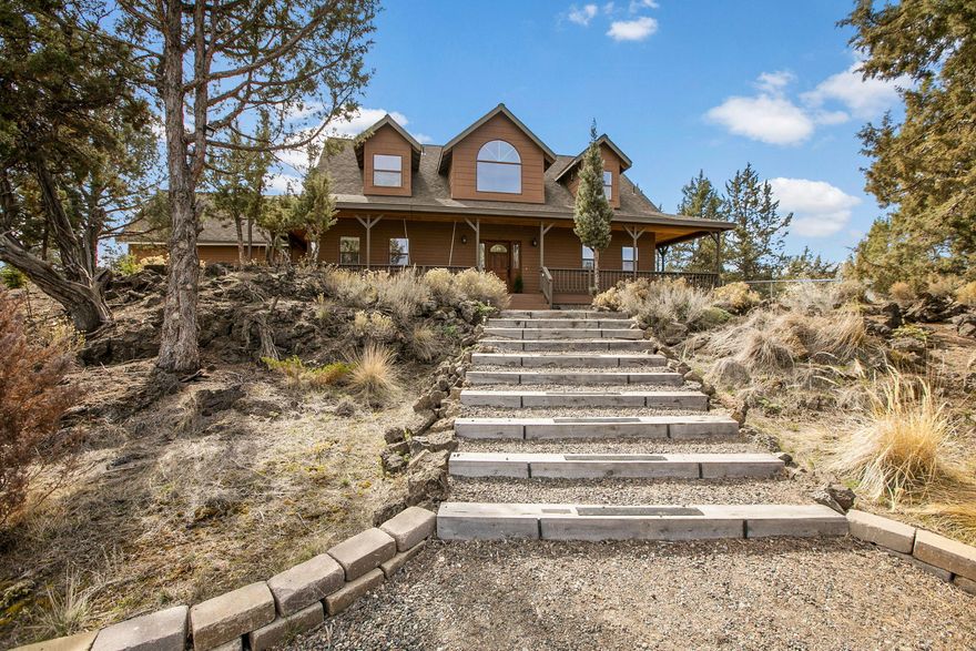 Welcome to this beautiful custom home situated on 4.82 acres. Offering a nice private setting with water views of the COI main canal during irrigation season April-October and a gorgeous wrap around covered porch and back deck. There are 4 bedrooms, 3.5 bathrooms which include a guest suite/rentable space above the garage with it's own entrance and full bath. Inside the home you will find an inviting entryway, formal dining space, spacious kitchen with butcher block island and a great room with a fireplace. Large primary bedroom on main level boasts a Jacuzzi soaking tub, walk in dual head tile shower, double vanity sinks, and a walk in closet. Upstairs has a flexible loft area along with the other two large bedrooms and full bath. 30x40 detached shop with an office and bathroom. This location is great sitting right between Bend and Redmond making it easily accessible to either city.