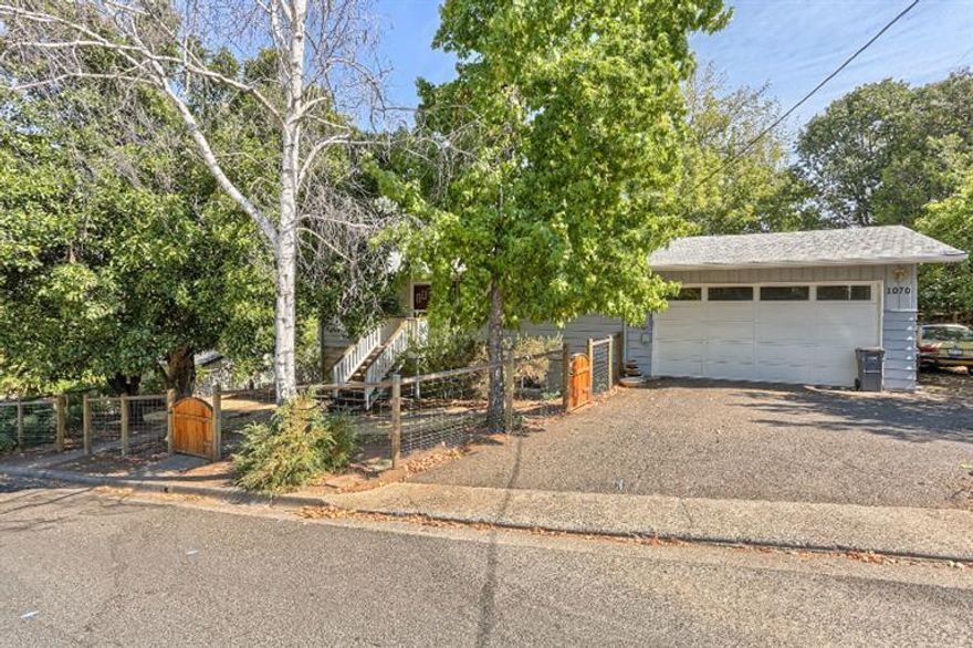 Excellent opportunity for a two family setup in a great Ashland location with exceptional mountain views. This two story four bedroom home provides two bedrooms and one bath on each floor both with private entrances, fireplaces, kitchens and living rooms. This home is in great shape with lots of light and a large private fenced yard with apple and persimmon trees. Both levels open to the fenced backyard.