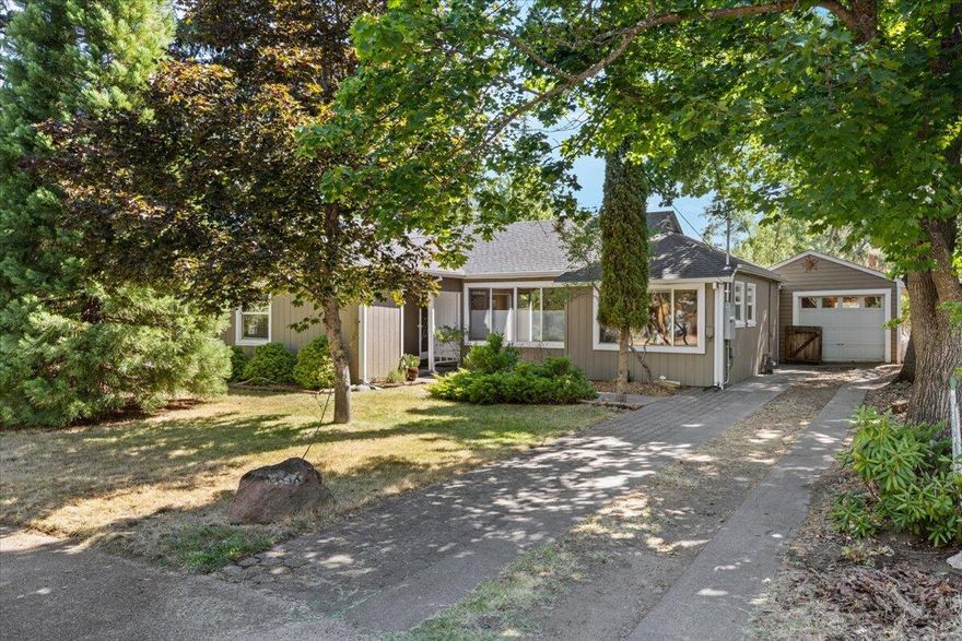 Discover the perfect blend of character, comfort, and future opportunity in this beautifully updated home, ideally located in a walkable neighborhood just steps from Sammich and other local favorites. Recent upgrades include a brand-new mini split system, water heater, and electrical—offering peace of mind and energy efficiency.

Inside, you'll find updated modern light fixtures, distinctive arched walls, and a kitchen window with a view into the expansive backyard. Step outside and experience the openness of nearly a 1/4 acre, featuring a large covered deck, greenhouse, and deer-proof garden enclosure—perfect for relaxing, entertaining, and cultivating your own food.

Bonus: a 500 sq/ft detached garage offers exciting potential for an ADU (Accessory Dwelling Unit)—ideal for guest space, rental income, or a home studio.

This home combines important updates, unique charm, and flexible options for the future!