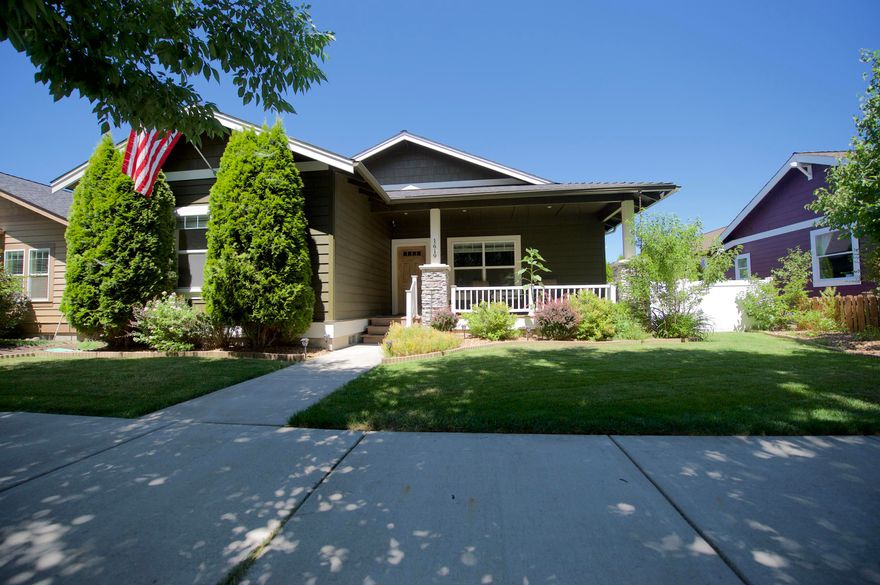 Classic, well maintained craftsman charmer! Located in the desirable established Canyon Rim Village Neighborhood. Access to the neighborhood park and dry canyon, this location is highly sought after and won't last long! The home offers a large open floor plan, wood flooring and 3 bedrooms and 2.5 Baths. The 1816 square feet  lives large with a well sized master with guest room separation. The two guest rooms have an adjoined Jack and Jill  full bathroom while there's an additional half bathroom for guests and large laundry room. Stay comfy this summer with AC and cozy in the winter by the gas fireplace. The alley access garage is large and has additional parking for a small RV or extra vehicle. With a front and back porch, fully fenced this picturesque home has it all!