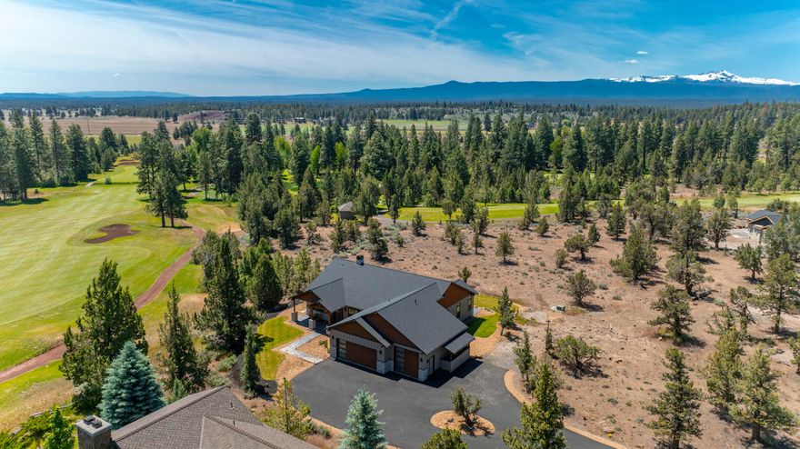 Thoughtfully designed and beautifully crafted, this welcoming & stylish custom home is ideally situated beside Aspen Lake's 12th fairway, maximizing both privacy & Cascade peak views. The open main living space incorporates a towering floor to ceiling stack stone fireplace & a kitchen filled with extras including Thor appliances, 10' center island, under cabinet lighting & mixer cabinet with lift. Lofty 10' ceilings & 8' solid core doors throughout the home add to the sense of spaciousness, while separation of the 2 guest bedrooms & full bathroom from the primary bedroom enhances the feeling of privacy. There's so much to appreciate in this primary suite, with patio access, tray ceiling & spa-like bathroom that includes auto-on under cabinet lighting, backlit mirrors, dreamy walk-in shower & separate access to the laundry/hobby room. A dedicated office, attached garage with EV wiring & an oversized 3rd bay with 10' door, plus easy access to the thriving town of Sisters, it's all here!