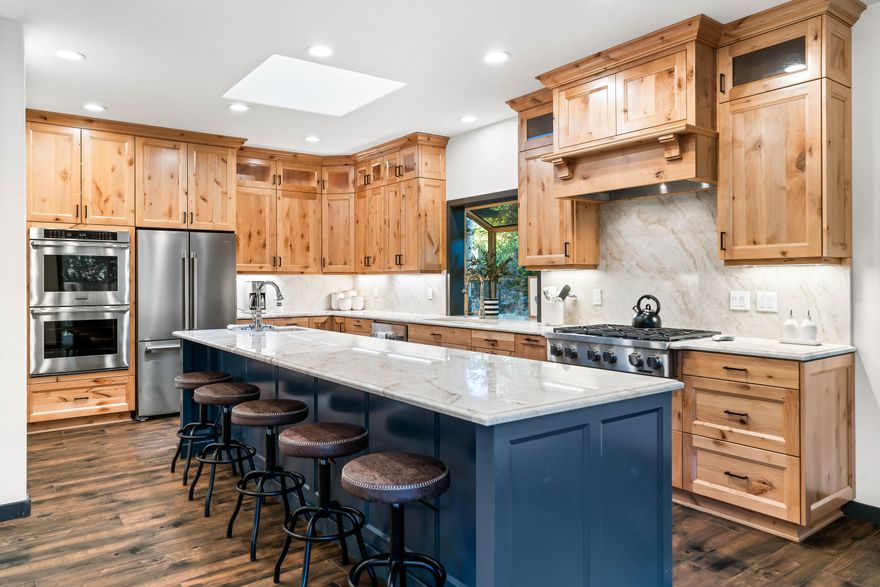 This high-end, fully remodeled in 2022 Sunriver home offers 2,500 sq. ft. of main level living on a quiet street, perfectly positioned at the edge of Sunriver Resort, overlooking the 6th hole of Woodlands Golf Course. Enjoy GC views from both levels of the home. Luxury finishes include stunning quartzite counters & elegant tile flooring throughout. The chef's kitchen features a Dacor range, two dishwashers, 2 Ovens and an oversized island for effortless entertaining. With 5 bedrooms & 4 full baths, there's plenty of space for everyone. Zoned heating w/ radiant floors downstairs ensures year-round comfort. Multiple living areas, 3 gas fireplaces, & a large second-floor deck w/ a hot tub & outdoor kitchen make this home an entertainer's dream. The 3-car heated garage, w/ epoxy flooring, is set up as a game area, & a Tesla charger is ready for use. This home is move-in ready, w/ nearby hiking, fly-fishing, biking, & skiing. Ready for the next owners to enjoy