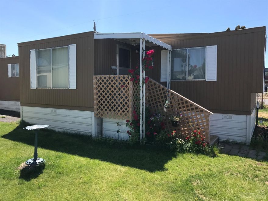 Home ownership is possible. Nice, well cared for clean manufactured home. Move in ready. Interior recently painted and floors upgraded. Pellet stove and swamp cooler included. Family friendly area. Buyer must be approved by Milestone Property Management. Current space rent is $450.