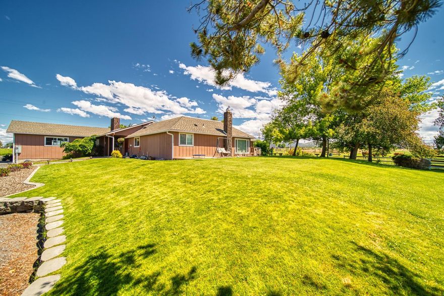 Older custom home on almost 40 ac with 34.6 ac irrigated has been completely updated with granite counters and updated bathrooms with an attached 2 car garage. There is a newer detached garage, fully finished and insulated with power and wired for a Reznor heater, large barn with 8 stalls and steel runs, a 720 sq ft shop/tack area and a 720 sq ft Hay/RV storage area. Second home has been completely updated as well and is 1296 sq ft 3bedroom/2bath. Both homes have beautiful Cascade views.