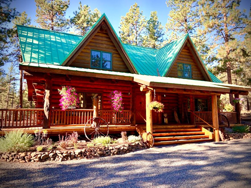 Stunning hand scribed Oregon Log Home with no detail missed. Perfect for a retreat getaway or primary residence. Hand-crafted 2-story stone F/P is the heart of the home w/windows galore to bring in an abundance of light & natures beauty from this almost 4-acre parcel in the trees. Amazing custom staircase w/2 Skip Armstrong carvings & stunning Junipine base. Spacious kitchen w/butcher block island. 2 guest bedrooms downstairs & an upstairs primary suite w/separate reading area & TV room! Once you walk in you won't want to leave! Truly a Log home masterpiece, so warm & inviting! Property also offers a large 2-car shop w/full permitted bathroom, additional storage & side shelter overhang for equipment & toys. Beautiful flower garden, outdoor fire pit & wood storage shed finish off this amazing property. Junipine Acres offers homeowners private access to the gated neighborhood park & picnic area, which winds along Whychus Creek. Call for your showing today!