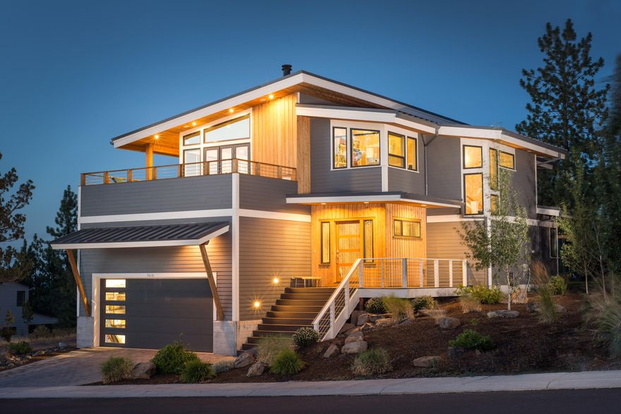 True curb appeal awaits you at this Modern Dream of a home in the highly coveted Marken Heights neighborhood on Bends Westside! This open floor plan offers clean lines, bright lighting, and a timeless touch throughout with Bamboo floors, accent walls, high end finishes, and true style. This home was intentionally designed as a reverse living floor plan so the beautiful mountain views could be well enjoyed. A bonus room, 3 bedrooms/2 bathrooms on the main floor, lead you to a fenced backyard with a private feel, and hot tub. Head up stairs to the light filled & very happy living, kitchen & dining that is surrounded by a wrap around deck to enjoy mountain views and sunsets. On this floor you will also find a refreshing office space with the perfect view of bachelor, The master suite, & fitness room. Lastly, a spacious 3 car tandem garage with extra storage. This perfectly appointed LEED certified home has been exceptionally maintained and is just minutes from everything Bend has to offer