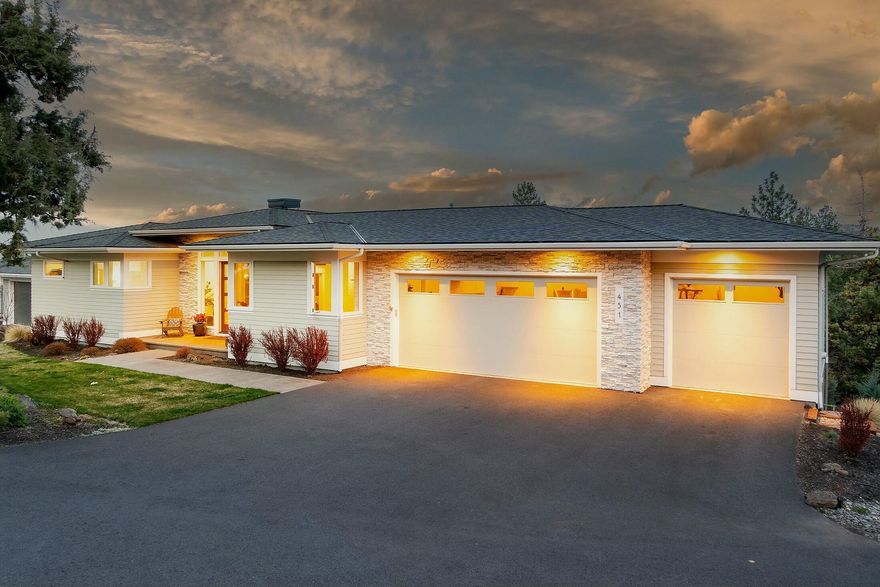 This beautifully designed home offers a perfect blend of comfort, style, and convenience. Step inside to discover a bright, open floor plan with vaulted ceilings, expansive windows, & high-end finishes throughout. The spacious gourmet kitchen boasts stainless steel appliances, custom cabinetry, & a large island—perfect for entertaining. The living area features a cozy fireplace and access to the outdoor patio, where you can enjoy breathtaking views. The primary suite is on the main floor featuring tiled shower, tub & a generous walk-in closet. Additional bedrooms downstairs provide ample space for family, guests, or a home office. Outside, the beautifully landscaped yard and covered patio create the ideal setting for year-round enjoyment. A 3-car garage and abundant storage throughout the home ensure there's plenty of room for all your gear, tools, and outdoor equipment.