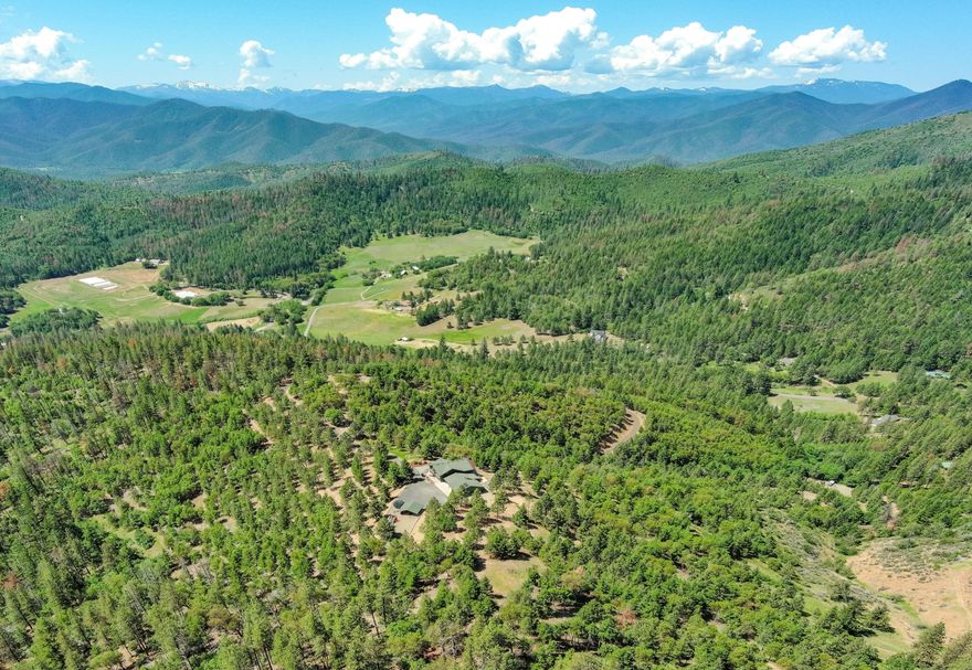 Private Mountain Top Retreat - Expansive & Forever Views. Relax & enjoy this magnificent & peaceful setting - it will surely warm your heart & energize your soul. Live a resort-like lifestyle on 40.77 scenic acres w/access to & adjoined on (3) sides by 777.5 acres of BLM land. The unique beauty of this property will be a reminder & inspire you to slow down, take a deep breath, & appreciate traditional values; Live/Love/Laugh. Enjoy nature less than 20 minutes to area shopping, fine dining, award-winning wineries, Jacksonville, or Medford. Every room with a view, this well-maintained 3,107' sqft, (4) bdrm., (3) bath home offers open spaces, vaulted ceilings, light/bright interior, & a full walkout daylight basement for guest/mother-in-law quarters w/private entrance & parking area. Over-sized fin. garage, +insulated/conditioned shop, lrg. pantry, inside/outside storage rooms., hot tub, expansive deck, paved driveway/parking near home, incredible pavilion/playground, & much more.