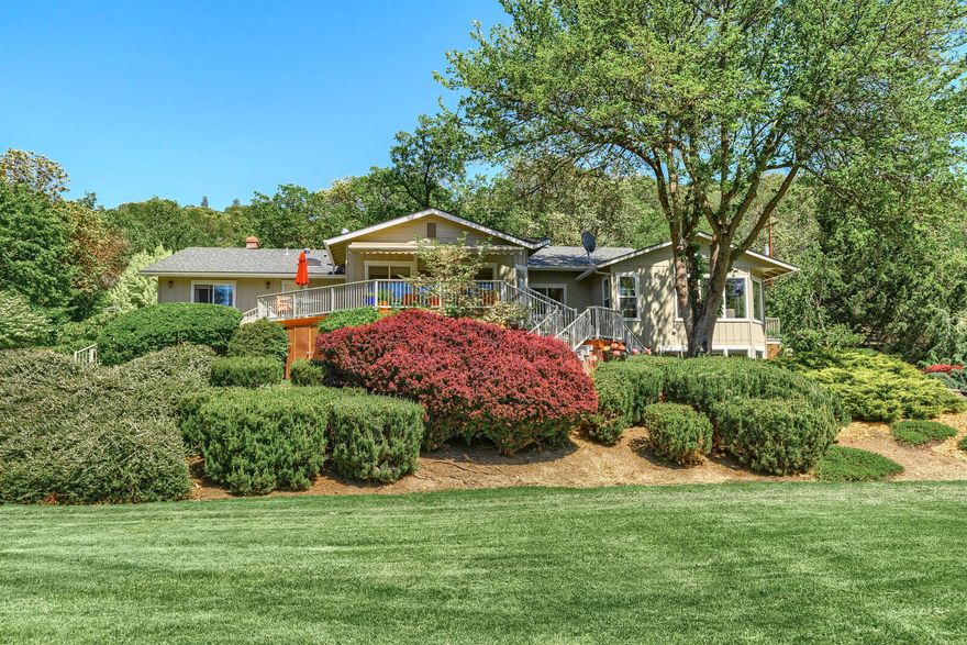 Spectacular home on the Rogue River with 8.7 Acres of river frontage!
Newly updated 3774 sq.ft home with manicured grounds and approx 1700 ft. of river frontage is one of a kind! House features 3-4 BD/office 3 full BA with 2 full master suites; a wonderful chef's kitchen with hickory cabinets, granite, gas stove top, stainless appliances, double oven, breakfast nook, formal dining and more. Open floor plan features huge great room and flows from the entry, kitchen and dining area. The oversized master suite has walls of windows to take in the river views and the other master has its own fireplace. Tile and granite bathrooms plus a wonderful large family room. Beautiful wood floors, vaulted ceilings, slate entry, and more. Multi decking and patios for entertaining and outdoor living. This home also has many extra storage features such as an oversized utility room and stand-up attic.  Park like grounds gently slope to the river and include a barn for horses. A private oasis.