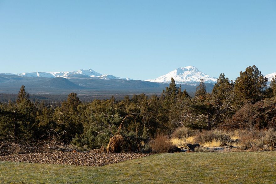 Stunning Cascade Mountain views and a truly central location define this home on almost 7 acres. Perched on a high, scenic bluff, the property overlooks a beautifully irrigated hay field, offering sweeping, unobstructed views and a peaceful sense of elevation and privacy. It's not uncommon to enjoy frequent wildlife sightings from this vantage point, adding to the natural beauty and tranquility of the setting. Perfectly positioned between Bend, Sisters, and Redmond, this location offers the best of Central Oregon living—quiet surroundings with quick access to dining, shopping, recreation, and commuting routes in all three directions. This is a rare opportunity to enjoy expansive views, open space, and a central location all in one exceptional property. Owner Financing Available.