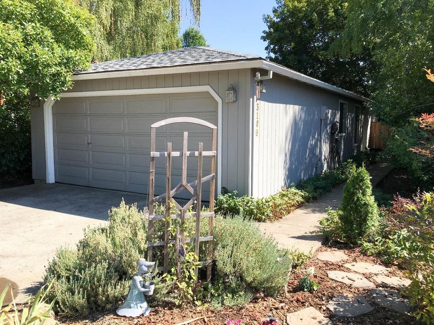 Great East Medford Home at the end of a cul-de-sac. This 2 bedroom 1 bath is on .20 Acre lot and is tucked back off the main road. The main living areas have Laminate and Tile floors. The kitchen has a large eating bar and perfect for entertaining. The living room has access to the back patio and nice sized fully fenced back yard. There is a 2 car garage and extra parking area. Central Heat and AC, Indoor Laundry Area.