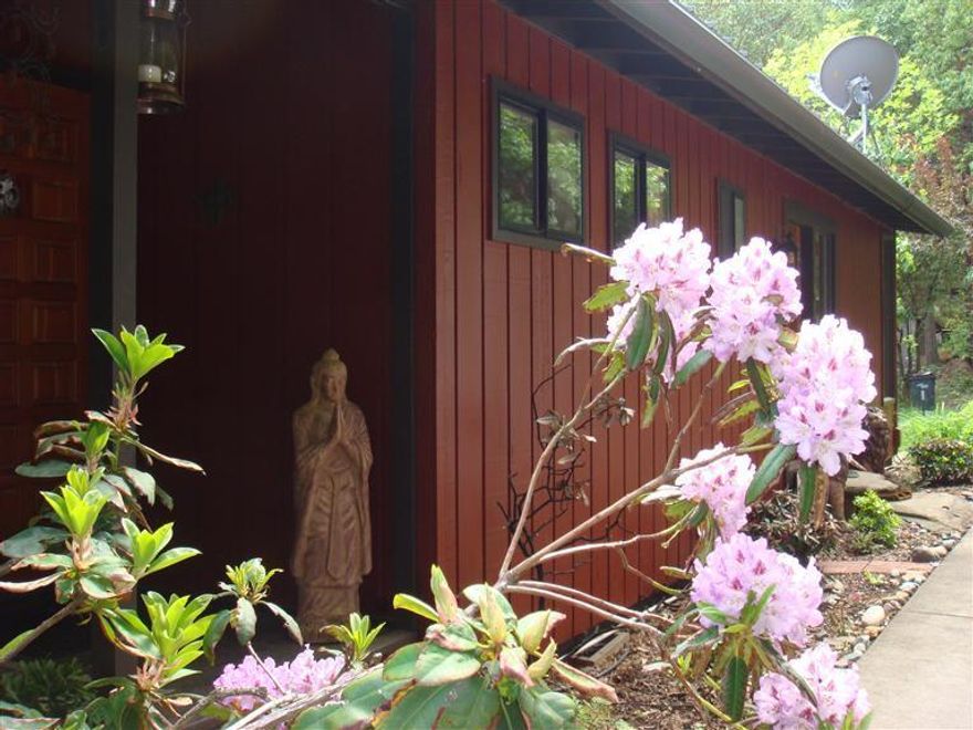 Best Value in Rural Talent market. Price to Sell. Enchanting forest & creek side setting. The openness of the home is graced with abundant natural light. Wonderful oak, fir, and bamboo flooring add to the spaciousness with beautiful views from the dramatic living room windows. Enhancements include new metal roof, deck with copper rails, interior/exterior paint, windows, carpet, & solid wood doors. Complete bathroom remodel finished with slate, custom mosaic tile, double tub, custom cabinets, and radiant floor heat. New patio or sport court. Zonal heating system. Experience this magical home on 4.08 wooded acres with a yearly creek and a circular drive.