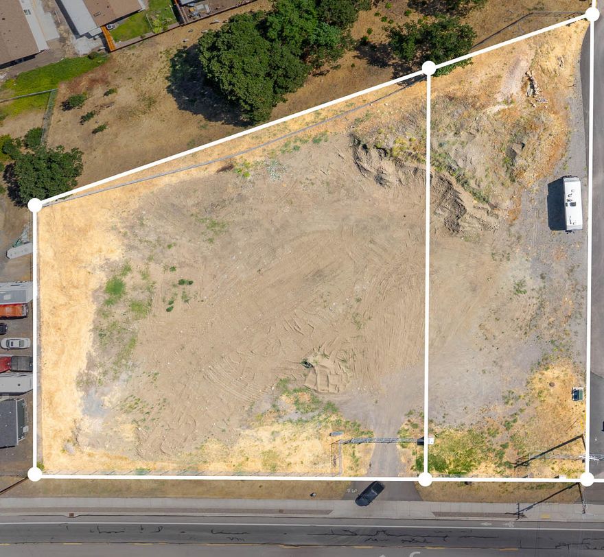 Two industrial-zoned tax lots totaling 1.67 acres, fully fenced and ready for development! Ideal for storage units, RV parking, warehouse space, or other commercial/industrial uses. Excellent visibility with prominent signage on South Pacific Hwy, just minutes from freeway access.