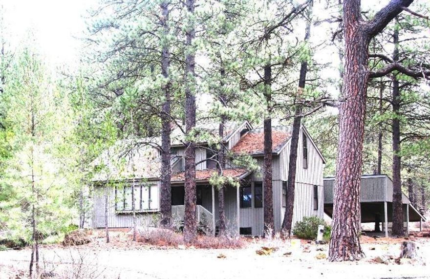 Stylish home features vaulted-open-beamed ceilings. Spacious floor plan w/ some recent updates such as beautiful kitchen & possibly heating-AC system. Lovely kitchen features newer cabinetry, upscale stainless appliances, slab granite. Main-level master w/ adjoining bath; 2 bedrooms upstairs w/ vaulted-beamed ceilings, adjacent bath & loft area, cozy wooden walls, windows all around keep it bright. Privately situated on wooded lot adjoining common area w/ paved roads & bike paths, close to water-park.