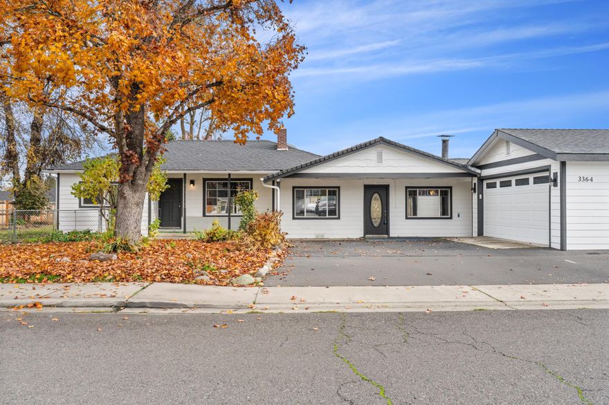 Ideal Two-Family or Multi-Generational Home! This spacious 4-bedroom, 3-bath Central Point home offers the perfect blend of togetherness and privacy. Designed with flexibility in mind, it features two separate living areas each with its own entry. One side includes a kitchenette, oversized bedroom, walk-in closet, full bath, and private living space, making it ideal for extended family, guests, or even rental income. The main living area offers an open floor plan, updated finishes, and access to a large fenced yard perfect for gatherings or gardening. With a newer roof, fresh exterior paint, and a 2-car garage, this home is truly move-in ready. Connected only by a shared utility room, it gives everyone space to live comfortably while staying close. A rare gem to find offering versatility, value, and peace of mind!