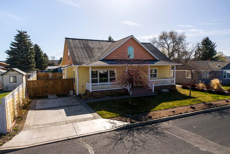 Beautiful home in mid-town Prineville. Tasteful finishes greet you with cherry cabinetry and floors throughout, granite-tile countertops, Great room living, with spacious kitchen, dining and living rooms,Gas fireplace and attractive entrance. Primary bedroom is on the Main level, w/ tiled primary shower, and two spacious bedrooms and guest bath upstairs. Outside is charming with established landscaping, covered front porch, large fenced yard, and super spacious back porch-with views of Barnes Butte- that leads to the detached, double garage. Lots of garage storage, with parking in front and rear. Just blocks away from Barnes Butte Trail head. There is NO HOA in this well established and popular neighborhood.