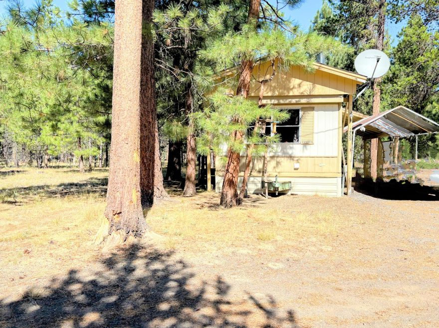 Check out this charming property featuring two separate tax lots and a manufactured rental on one, all situated on a fully fenced, flat 2.05-acre lot just 10 miles south of town. The existing 520 sq ft home, built in 1974, is in good shape and comes with a new wood stove to keep you warm during the cooler months. With two lots to work with, you have plenty of optionsâ€''whether you want to build a second home, create a private estate, or develop a multi-family residence. This property offers a fantastic opportunity to craft your dream home, a cozy getaway, or a multi-unit living space.



Taxes and acreage listed are combined totals for both properties.