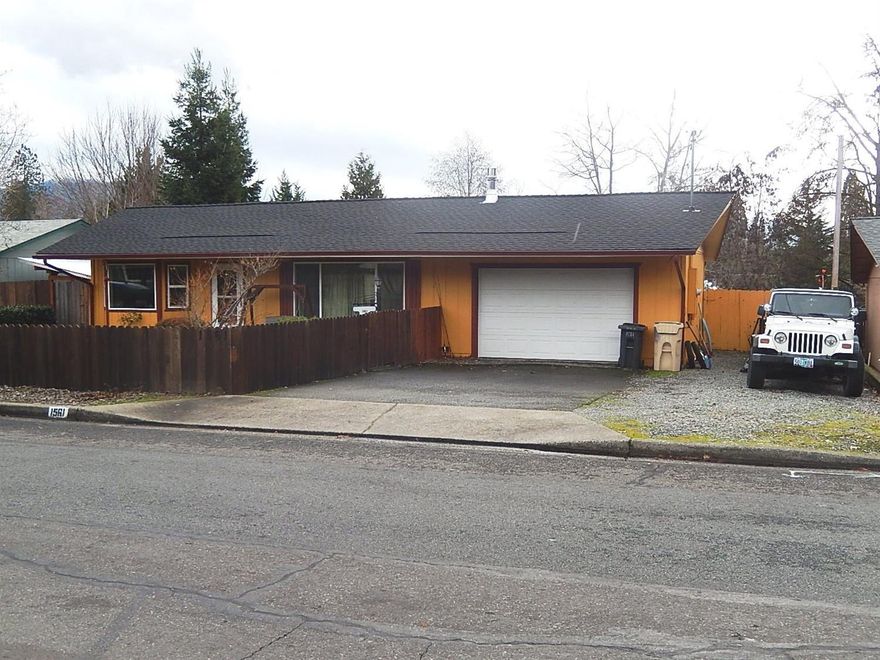 You will love this quiet established neighborhood! Solid 1973 Home has a Brand NEW $20,000 Roof and all NEW Vinyl Double-Paned Windows & Slider. Big Living Room, Large Kitchen with Lots of Cabinetry, New Garden Window, New Sink, Breakfast Bar, Gas Range/Oven and Tiled Floor. Spacious Dining area with big Bayed Window. Guest Bath has New Flooring & new Toilet. Nice-Sized Bedrooms. Inside Laundry Room includes a half bath and exterior door. Convenient Tiled Office Nook off Living Room. Big Covered Patio. Huge Back Yard is privacy-fenced & offers nice garden area. Fenced off Chicken Area with nice coop. Egg-producing Chickens can stay if new buyers wish. Partially-finished Garage has pull-down stairway to attic storage. Home has radiant ceiling heat PLUS a Natural Gas free-standing Stove that efficiently heats this entire home. Vivant Alarm system is installed - just needs service hook-up. Property has irrigation rights for outside watering through Grants Pass District.