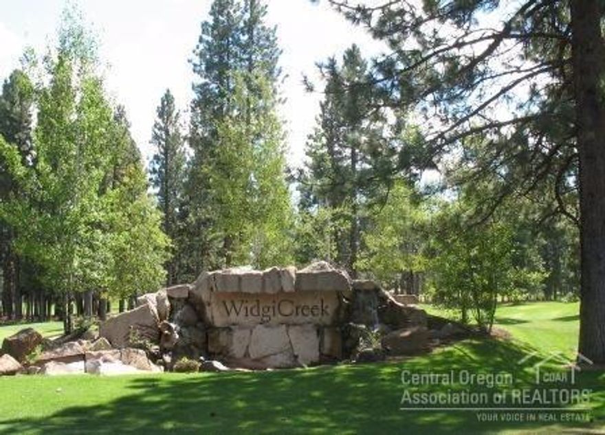 Dramatic location on 18th hole lake at Widgi Creek. Customized Townhouse. Upgraded with built-in alder cabinetry, hardwood floors, stunning stone wall water feature. So many EXTRAS! 3 BR (2 Masters). 3 Baths. Open loft/office. Great Room, Stone Fireplace. Vaulted ceilings. Wooden Blinds. Open Kitchen. Granite counters/Bar. Overlooks 18th hole & lake. Double Garage plus storage. Surrounded by Nat'l Forest. Next to Deschutes River.15 min.to Mt.Bachelor 5 min to Old Mill.