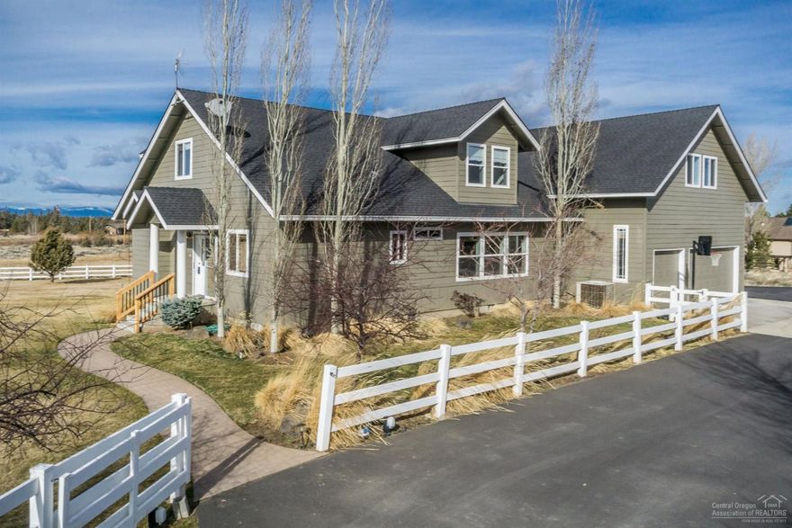 Offering this stunning custom home with AMAZING Cascade mountain views on nearly 5 private acres w/irrigation & pond. Features include two master suites with one downstairs, gourmet kitchen w/SS appliances, granite slab counters, copper sinks, hickory wood floors, high ceilings, huge bonus room w/wet bar, large deck to take in sunsets, 3-car garage with shop area, tons of storage, underground irrigation & so much more! Only 10 minutes from town!