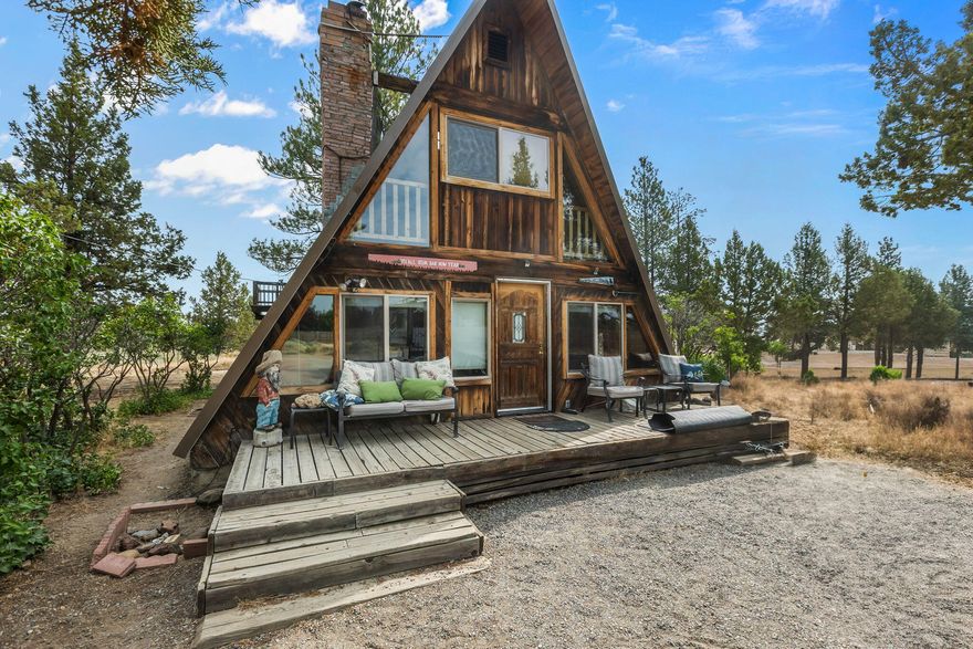 Calling all DIY enthusiasts and visionaries! This rustic A-frame is a rare find, offering the perfect canvas for someone with a passion for renovation and a knack for creativity. Situated on five acres surrounded by nature, this property has great potential and is ready for a fresh update. With the right touch, it can be transformed into something truly special. Some Cascade Mountain views are the bonus!
The property features ample space for expansion, gardening, toys, and chickens. Enjoy the peace and privacy of plenty of elbow room that's a short drive to Sisters or Bend and all things outdoors.
If you're ready to roll up your sleeves and create something extraordinary, this home is waiting for you. A great location makes this diamond in the rough a fun opportunity to make your vision a reality. Whether it's your home or weekend escape, don't miss out on making it yours! Bend address in the Sisters School District.