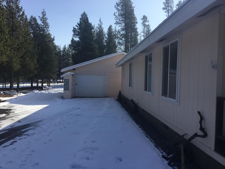 Amazing 1 acre parcel situated on a corner lot. Limbed mature Ponderosas and manicured lot featuring full Asphalt driveway, oversized double car detached garage/shop with tons of storage and power with pull through door. An additional detached carport. The lot is fully fenced with double gates at two entry points. There is a private well, RV parking and hookups. A manicured lawn and more! Like living in a park! The interior features 3 bedrooms, 2 bath, kitchen, living and dining area. Mud/Laundry off the kitchen with outside access. Add your cosmetic touches to this property and own your piece of Central Oregon.
Please follow COVID guidelines.
 Seller will not pay commissions on seller credit towards buyers closing costs and prepaid or loan points paid by the seller on behalf of the buyer.