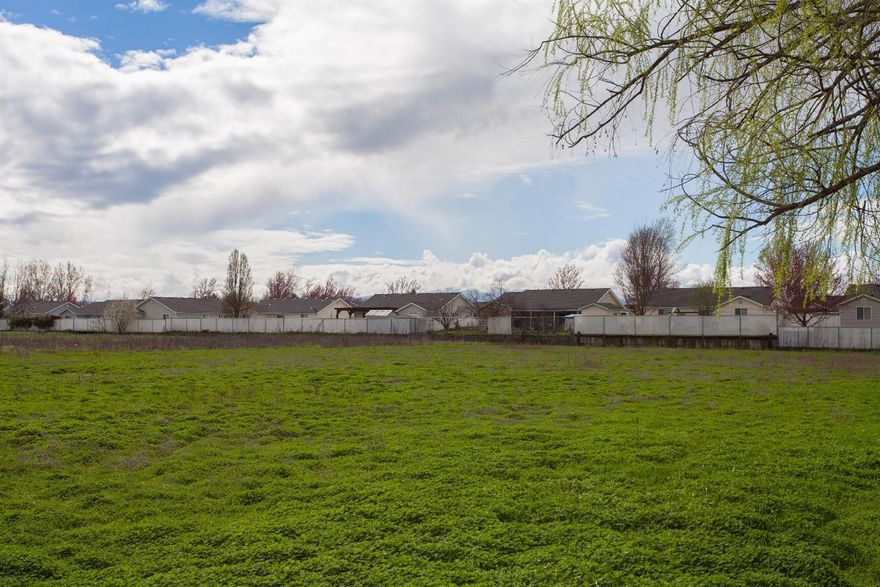 Opportunity for potential future development. 2.27 Acres zoned WCUR-6 or (6) dwellings per acre with curbside public water & sewer and a newer single wide on the property for rental income. 2009 single wide 2 bedroom, 2 full bath home with room to expand with garage or carport until land is developed. Buyer to complete their own due diligence regarding future development potential.