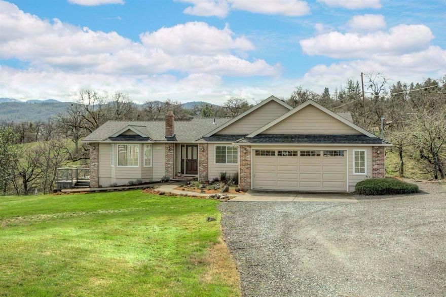 Lovely contemporary home in a perfect location! Here's your chance to feel like you are living in the country on a large 1.17 acre lot, yet very close to downtown Jacksonville's shops, restaurants and conveniences and only minutes away from Medford. Clean as a whistle and move-in ready! New interior & exterior paint, brand new roof, and new carpet and vinyl flooring. Gracious, comfortable main living area features: a Bay window and wood burning fireplace in the living room, a dining area in addition to a breakfast room in the kitchen which is big enough for a full sized table and a sun-room with southern exposure facing the creek. The kitchen has lots of cabinet and counter top work space. There is a nice, big master bedroom and bathroom with a jetted tub, step-in shower and double sinks. Enjoy the incredible mountain and creek side views. A rare opportunity you don't want to miss!