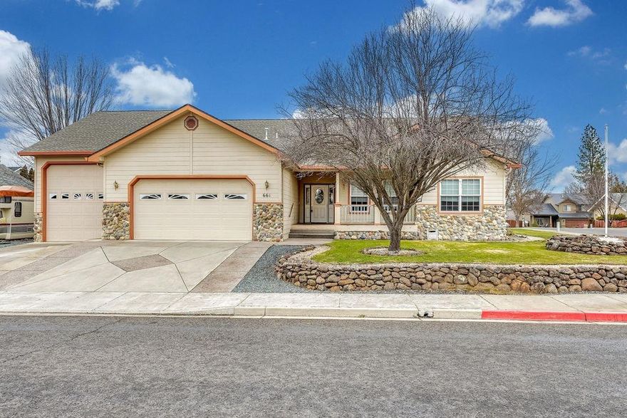 Echoes of the Ponderosa! A Corner lot & popular area, this custom build in 2001 fits right in. Relax on the covered porch/sitting area. Kitchen is open & functional w/oak cabinets & pull-outs, access to a lg. laundry rm/half bath. Appliances included, fridge, gas range/oven & disp. A gas fireplace warms the lg family rm/dining area. 3 Bed w/guest ba & a master w/large seating area, nicely appointed ensuite ba w/soaking tub & shower. The Back patio is covered/screen enclosed & plumbed for gas BBQ. The back yard boasts additional graveled RV parking & part grass. There is a separate, electrically wired workshop. Also, a lg RV Barn attached to the home with a 14ft roll up door, electric & sewer hookups. $10,000 Allowance for floor covering & paint.