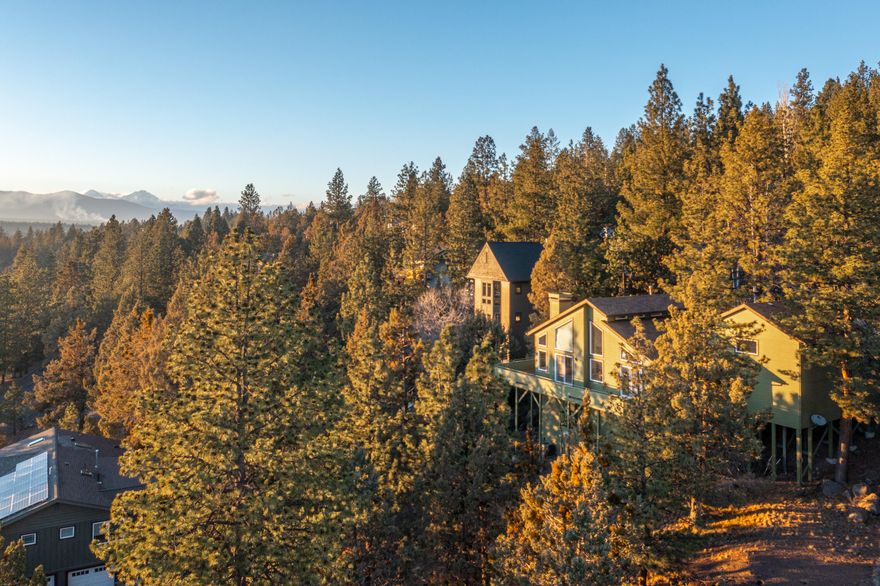Let the sunshine in from the southwest facing great room of this west hills home. The ceilings are high and the windows are abundant all with beautiful views to the south and west. From the smoke stacks of the Old Mill to a great view of Mt. Bachelor and the whole west side area in between. This spacious home sits on a .30-acre lot with natural landscaping. Variety of mature trees and interesting terrain with flat areas and sloped areas with boulders. Huge deck off the great room to take in the views. The pantry in the kitchen is huge and it has a portable built-in island. Primary suite is on the main level and has a big walk-in closet with numerous built ins. big bathroom with shower, soaking tub, double sinks and a bidet. Downstairs are 2 bedrooms a large bathroom and a nice sized bonus room. The big windows in the great room have custom Hunter Douglas blinds if you want to block out the sunshine. This amazing Westside home is waiting for your special touch!