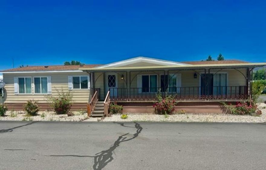 Nicely remodeled home in a 55+ community at Summers Lane Estates. This home has newer carpet, vinyl, paint, lighting, roof and appliances.  Open floor plan with two living areas, dining room, and an island.  Hardwood floors in the kitchen. Primary bedroom/bath has 2 closets, garden tub and double vanity. Covered deck and porch with ramp in the carport area.