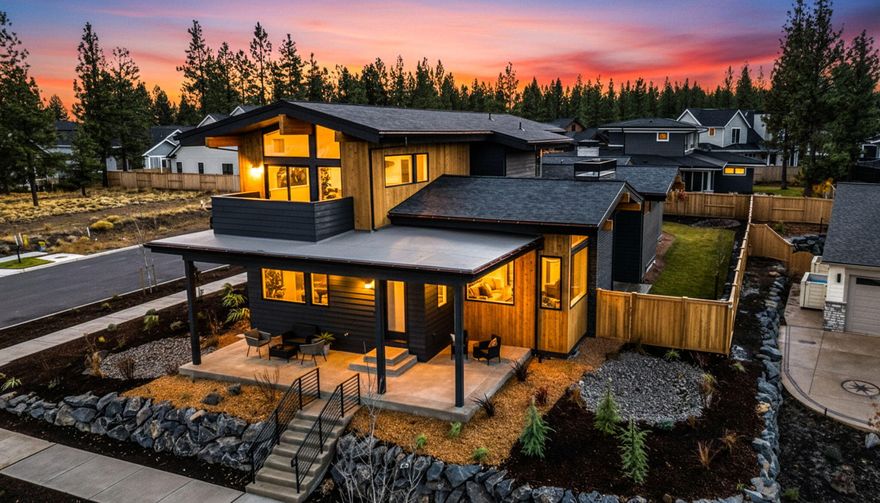 Experience luxury living at its finest in this contemporary prairie-style masterpiece by Bruce Wiechert Custom Homes, Inc., ideally located in the highly desirable Shevlin West community. Designed with a blend of modern elegance and timeless craftsmanship, it showcases rift oak cabinetry, custom lighting, hardwood floors, and premium Thermador appliances. Perched on a corner lot, the home enhances the amazing Cascade Mountain views and offers added privacy. A spacious three-car garage includes an RV bay, providing both style and functionality. The main level features a primary suite, guest bedroom, office, and open-concept living area that flows seamlessly to a flat, fenced backyard - perfect for entertaining or quiet relaxation. Upstairs includes two bedrooms, a Jack and Jill bathroom, a loft, and a bonus room with a walk-out deck - ideal for taking in the spectacular views.