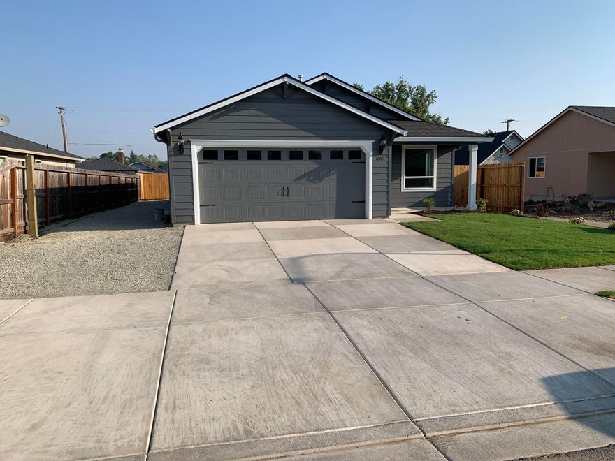 SUDDEN VALLEY SUBDIVISION! Centrally located for easy access to surrounding towns.  Gorgeous 1405' sq.ft, single level living. 3 bedroom, 2 bath home built by Horton Homes Inc..  Beautiful area in south west Medford.  Open floor plan with vaulted ceilings makes this home feel spacious. Home features, open concept floor plan, Custom cabinets, Granite, Gas appliances, Laminate flooring. Covered back porch.  Approx.12' RV Parking and much more. Selling agent is related to Seller and Builder. Some pictures are for illustration purposes only but very similar to actual.