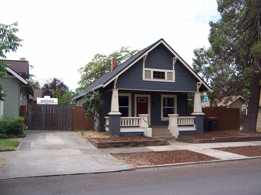 Charming 2 bedroom craftsman with lots of updates in recent years. This home is move in ready and featuring beautiful hardwood floors, newer flooring in bathroom, newer roof, newer vinyl windows, Newer interior and exterior paint. Large living room with gas fireplace. Kitchen has newer cabinets and granite counter tops, nice island, plenty of storage and newer matching stainless microwave, stove and dishwasher. There's also a dining nook and built-in cabinets with more matching granite counter tops attached to the kitchen. Back yard is fenced for added privacy. Unfinished attic area of approx. 400 square feet could potentially be converted to additional living space. Also, the current SFR-10 zoning allows for an (ADU) additional dwelling unit per City of Medford. Buyer to do their own due diligence with the City of Medford.