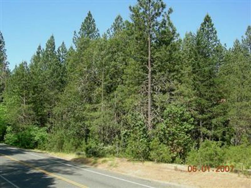 Gorgeous level 2.61 acre parcel. A great spot for a home site and the convenience of being just minutes from town. Unimproved parcel with utilities at the street, some meadow, semi-private, good mix of trees including evergreens and hardwoods. You will love this lot.