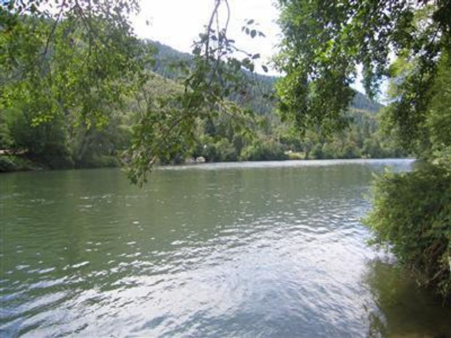 Enjoy family picnics,camping or RV ing on the beautiful Mighty Rogue River. This recreational lot is truly beautiful. Small shed for storage.