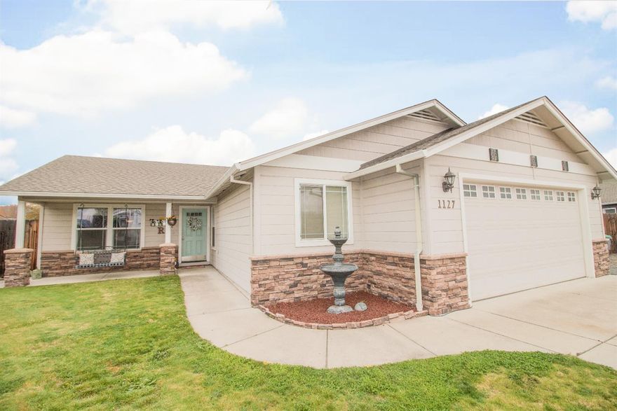 An open floor plan, stunning engineered hardwood floors and vaulted ceiling offer a warm welcome as you enter this immaculate, like-new home that's located in a nice subdivision at the end of a cul-de-sac. The beautiful kitchen with stainless steel appliances and breakfast bar is open to the living and dining area making it great for entertaining. Those looking for RV parking are going to love the storage possibilities here, starting at 22 feet wide and widening to 26 feet, you can easily park a camper and a boat as the parking space is 55 feet deep. The low maintenance landscaping with automatic sprinkler system in both front and back yard will be much appreciated on this large lot. This property is close to shopping, schools, and recreational activities - won't last long, come tour today!