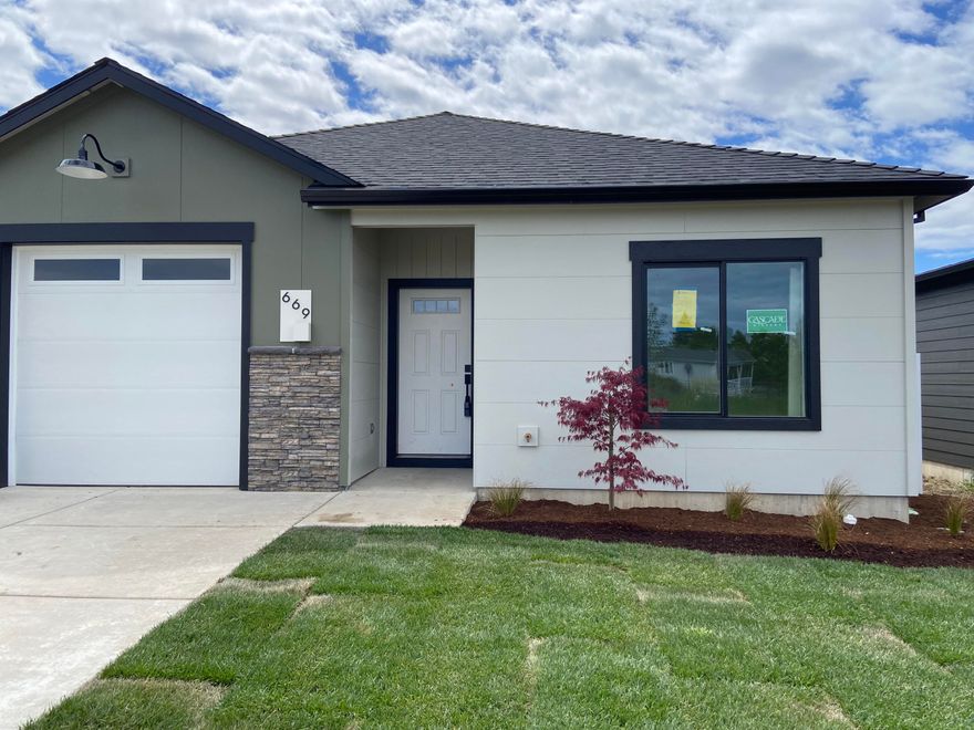 Meadows at Crooked Creek Phase 2--18 detached and 4 attached new homes conveniently located in the heart of Medford, with occupancy starting in spring 2024. This beautiful mid-century modern style detached single-story home by Rispoli Design & Build features 1,441 sq ft (per builder), 3 bedrooms and 2 full baths, and 100% Hardie cement non-combustible siding & trim exterior. Features include vaulted and/or 9-ft ceilings, quartz countertops, heat pump water heater, plank flooring, porcelain tile, ductless mini-split HVAC, kitchen island, s/s appliances, Diamond Mantra cabinets with soft-close doors & hidden hinges, fully finished garage with wi-fi opener, vinyl fencing, professional landscaping, Energy Trust certification, and much more!  Est. completion 4/12/2024.