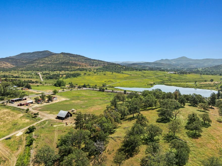Discover the ideal blend of utility and agricultural resources on this great ranch property in Southern Oregon. Encompassing approximately 125 acres, the land features irrigated pastures, functional improvements, and scenic terrain with potential for a number of agricultural pursuits. With water rights for 107.4 acres and a recently updated irrigation system already in place—including buried mainlines and risers across much of the property—this is ideal for grazing, hay production, or other agricultural pursuits. A modest farmhouse, historic barn, machine shed, and multiple outbuildings create a fully operational homestead. The land is predominantly level with gently rolling contours and features a picturesque oak knoll that offers panoramic views—an outstanding location for a future home. Whether for livestock, farming, or recreation, the property is well-suited for diverse uses and offers room to grow.