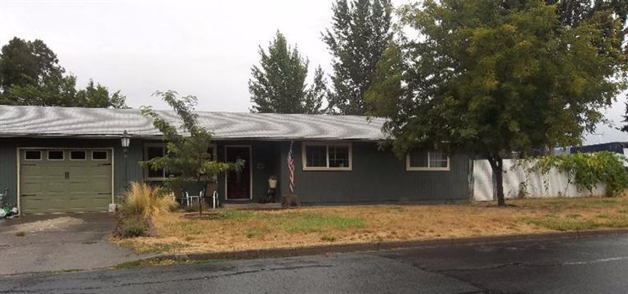 Cute house-3 bedroom, 1.5 bath on a good size lot with RV Parking. Kitchen has been remodeled with custom cabinets, new range/oven and granite counter tops. Dining area and kitchen, step down living room, laminate flooring with recessed lights, wood burning stove in living room. Good size bedrooms, master has a half bath. 1 car garage with RV Parking. Backyard has a nice patio with room still enough for playground set and trampoline. Hot Tub Included.