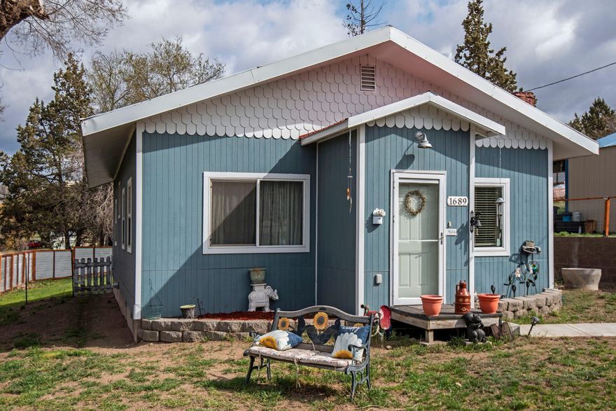 Don't miss out on these brilliant Cascade mountain views from this property, located in Terrebonne.  This home features a pellet stove, concrete countertops with beautiful solid wood cabinets, full height back-splash, a large open pantry, with bamboo and tile floors throughout the home. The property boasts of recently updated unique corrugated metal and wood fencing, mature trees, an additional separate work shop out building with power, a separate RV parking area with power and water, and a large 24 ft x 36 ft shop with roll up door and power as well as the plumbing already has been stubbed in.  Sitting on .42 acres, offering plenty of room for all your toys, and just a half mile walk to all the shops and restaurants of Terrebonne.  Call your favorite agent for your private showing.