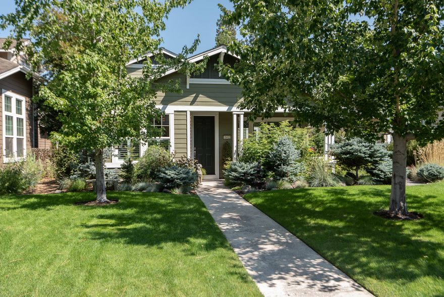 Live your best life in this lovely home in The Parks at Broken Top, a West side community with a pool, sports court, parks with picnic areas and a friendly place to walk and bike. The home's vaulted ceiling creates a sunny disposition, and well-placed windows maintain privacy throughout. With an open floor plan, you can prepare your meals while chatting with friends and family in the living room or as they're perched at the kitchen bar seating.  Share an evening meal in the inviting dining room with plantation shutters. Enjoy the convenience of the main floor primary suite, with 2 additional bedrooms upstairs. The upstairs loft is perfect as an office or homework space or cozy reading area. Extend your living outdoors to the covered front porch and the courtyard with expanded paver patio. This home is located close to trails, schools, the Old Mill District and all of Bend's West side amenities.