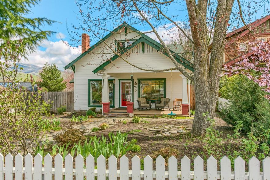 This delightful, sun-filled home is in a great location very close to town. Large pictures windows illuminate the living and dining rooms and charming front porch. The open kitchen is spacious and inviting, adjoins the roomy family room and charming enclosed sun porch. There is plenty of cabinet storage, a center island with new Quartz counter top and quality appliances. There are two bedrooms and two full baths on the main floor as well as the laundry room. Two additional bedrooms are located upstairs and the master suite has a great view. Hardwood and tile floors and loads of charm. There is plenty or gardening space, room for chickens as well as bunny hutch. Don't miss this beautiful Ashland home.