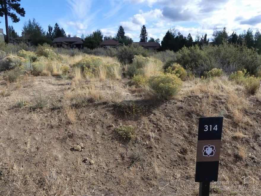 Backing to common space, this premier lot features privacy, amazing solar access and views. A future home can be well situated on this beautiful and elevated building site in Tetherow's coveted Crscent neighborhood.