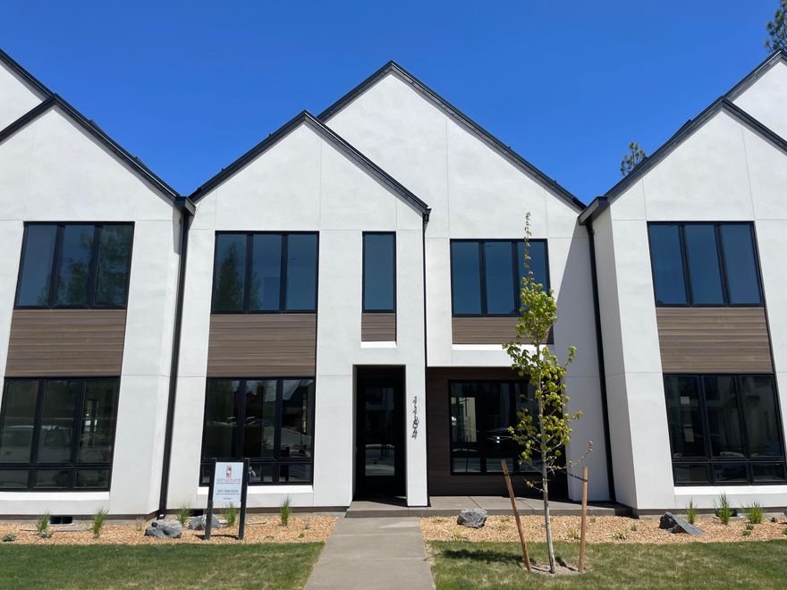 Trove Townhomes at Discovery West. This collaboration between COBA Award-Winning builders Structure Development NW and Curtis Homes LLC bring Scandinavian-inspired modern designs to Bend's desirable westside neighborhood. Clean lines and contemporary finishes, open floor plan and extraordinary living space. Great room with gas fireplace and hardwood floors. Spacious kitchen, professional appliances, large island and pantry. Dining area and covered patio perfect for entertaining. Guest suite on main level. Primary suite on upper level with vaulted ceiling, tile shower and walk-in closet. Two additional bedrooms, full bathroom, loft, laundry room and covered deck. Two-car garage and fully landscaped. Located in close proximity to future Discovery Corner Plaza, a vibrant mix of storefronts, gathering spaces and venue for neighborhood events. Easy accessibility to popular walking and biking trails. Trove offers carefree active living in this outstanding Discovery West location.