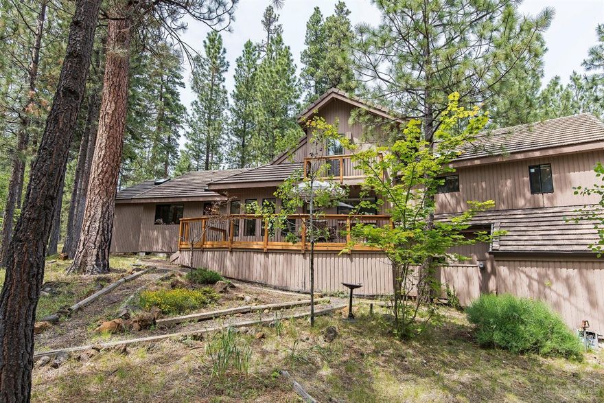 New roof January 2019! Privacy, privacy, privacy! This 2.14 acre property backs to National Forest at desirable Black Butte Ranch. Beautiful park-like setting amidst the towering Ponderosa Yellow Belly Pine trees. Views from the Great Rm, Master Bedrm & Back Deck. Only minutes from the GM Rec Center. Tiled entry opens to the LR, DArea and Kitchen. Lovely floor to ceiling stone fireplace in the LR w/ vaulted wood paneled ceiling. 2 spacious master bedrm/baths, another bedrm/bath & loft. Come recreate w/ family and friends!