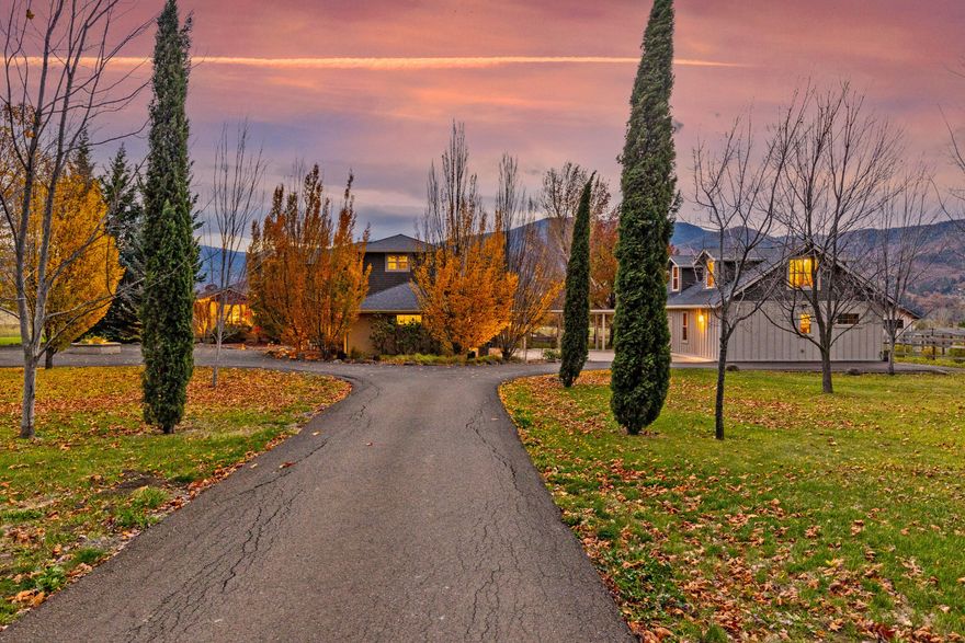 Exquisite Ashland custom craftsman two-home estate on 9.5 irrigated acres. Spectacular mountain and city views. Located 5 min. from downtown plaza. Beautiful tree-lined gated entry with circle drive. Main house amenities: 3532 sf, 3 bd, 3 bath, 3-car garage, library/office, formal living & dining rooms, family room w/fireplace, chef's kitchen, hardwood & tile floors, wrap-around patio for entertaining, master bdrm with sitting room & fireplace, spa-like master bath, walk-in closet, etc. Breezeway to the Guesthouse: 1623 sf, stunning kitchen, living room w/office nook, 2.5 baths, 2 bedrooms w/ master suite on main. Plus detached Studio/ office with mini split HVAC system.  Covered bbq area, outdoor dining patio, raised garden beds, detached tool barn & storage, fruit trees, etc. Perfect orchard, vineyard, or horse property.