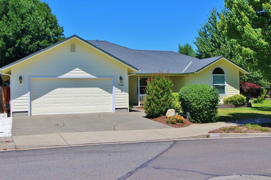 This beautiful home could be yours! Don't miss it; call today. The front porch is an inviting entrance to this, ready for you 1792 square foot, 3 bed, 2 bath home, open floor plan, vaulted ceilings, wood flooring and clean-classic lines. The kitchen is a great workspace featuring a double oven,  farmhouse sink, stainless refrigerator, dishwasher and plenty of cabinets for storage and pantry space. The granite counters and elegant tile backsplash add to the luxurious feel of this kitchen that expands openly into the family room and dining room. The water-feature adds to the relaxing atmosphere the outdoors provide and could be a great place for your BBQ and friendly gatherings. The master suite remains privately situated away from the other bedroom area and has a grand bathroom with walk-in shower, dual vanity, jetted tub and private commode. The two-car garage has a built in workspace and utility sink.